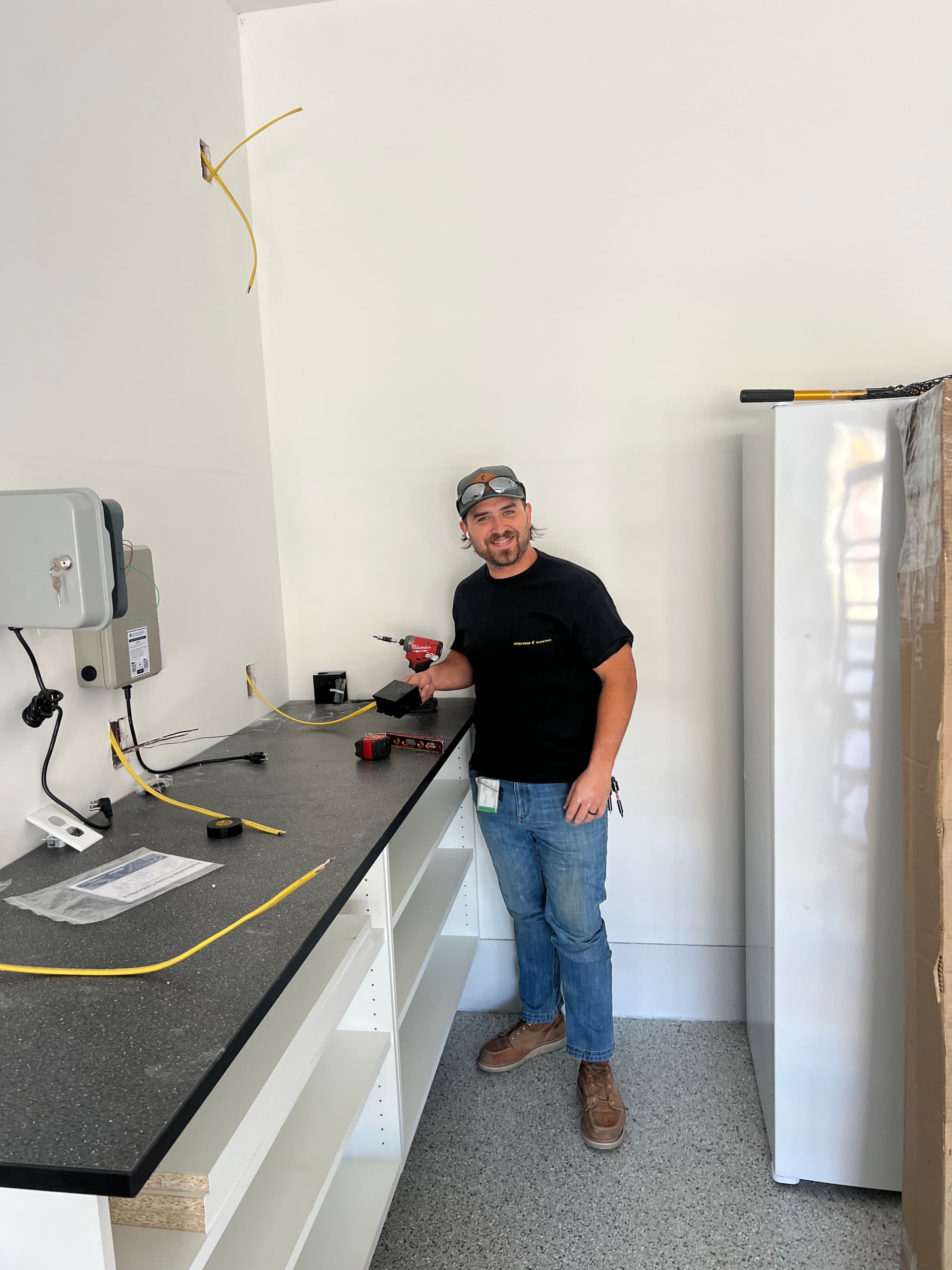 Tesla Level 2 Charger and Outlet Upgrade in a Clean Garage Space image