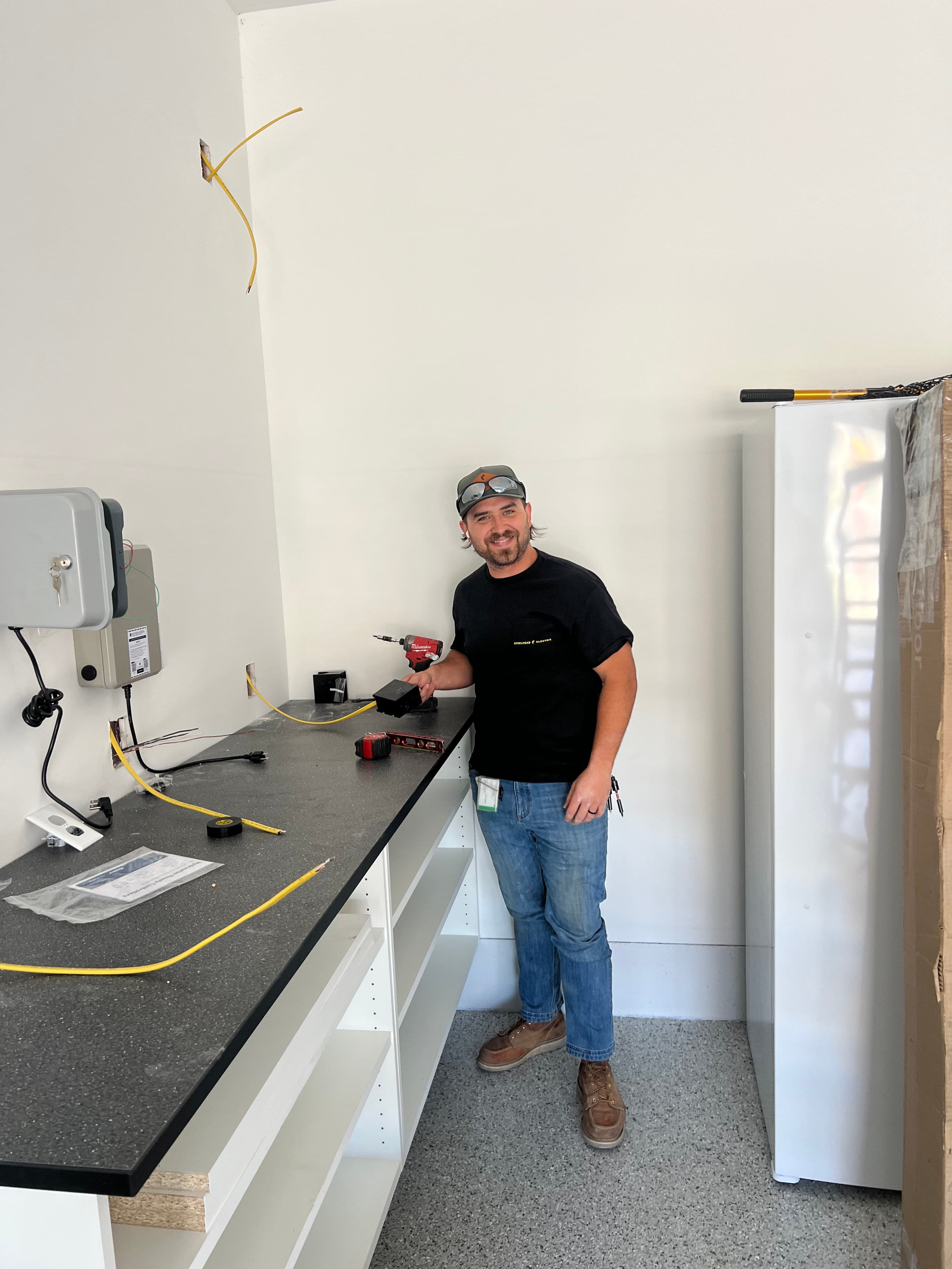 Project Tesla Level 2 Charger and Outlet Upgrade in a Clean Garage Space image